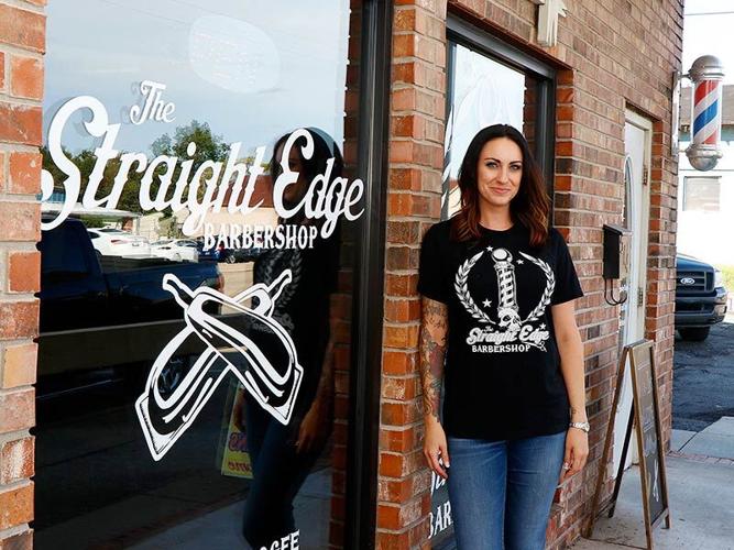 Emily Hullinger standing by the shop